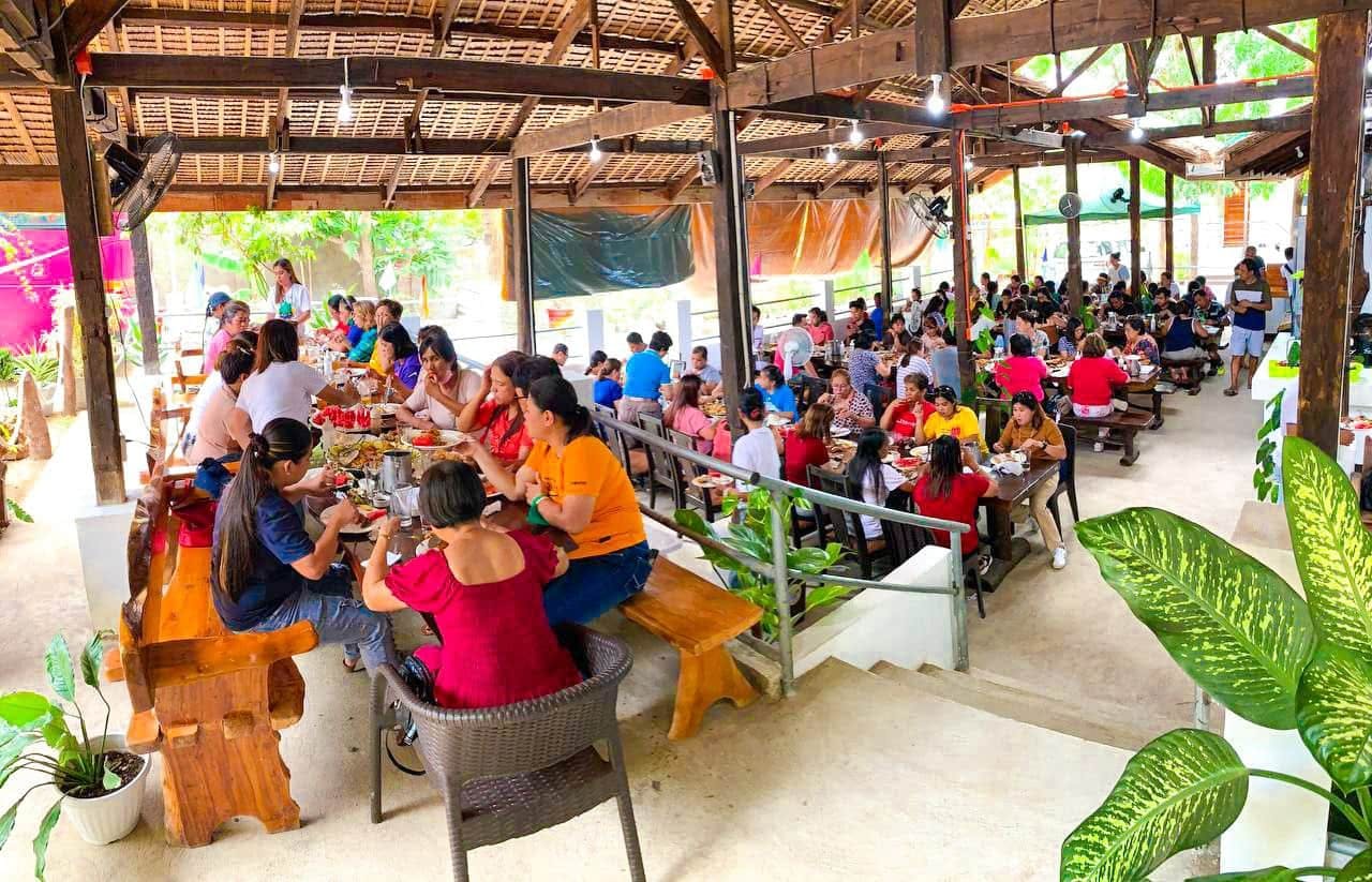 river village restaurant with alot of customers
